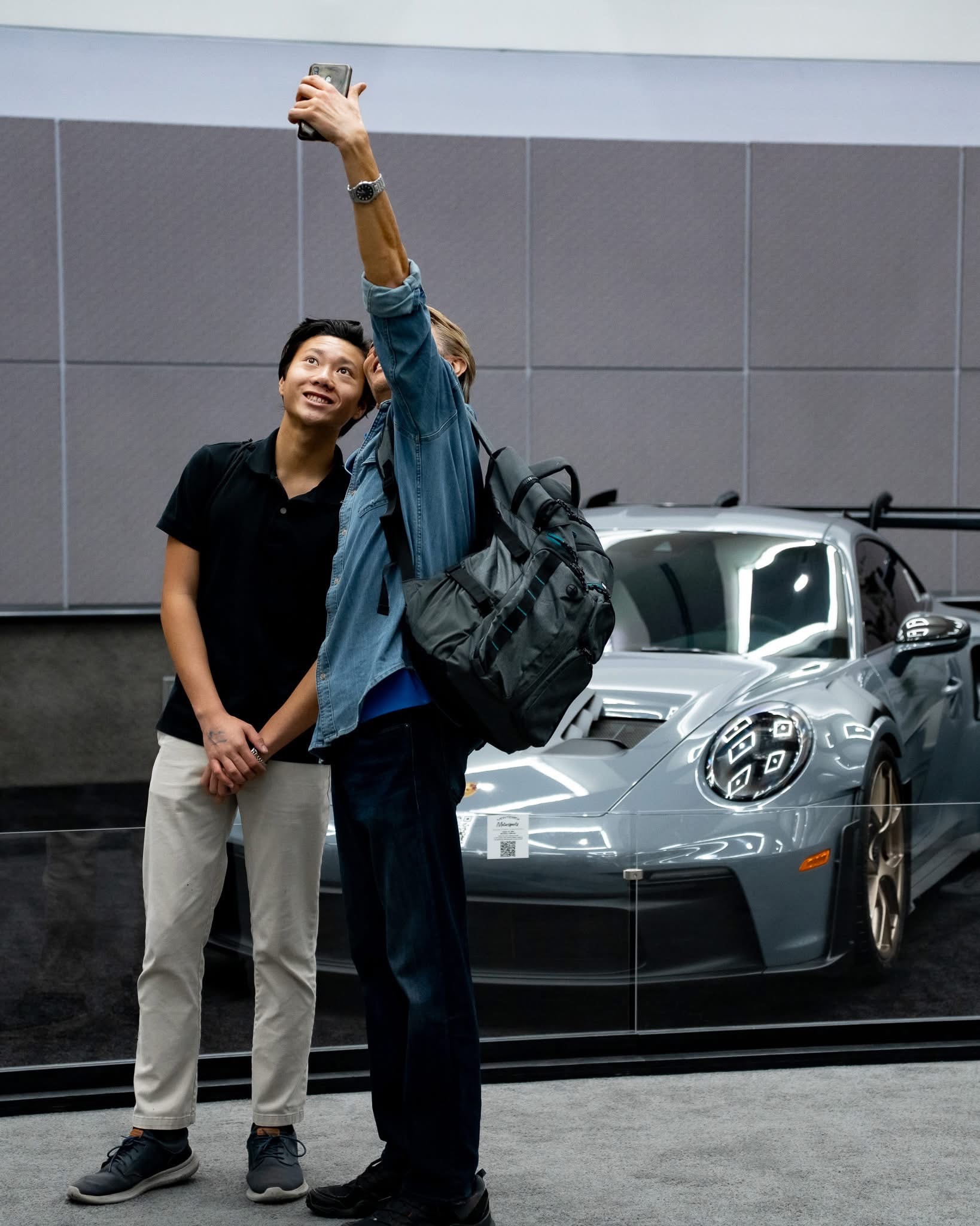 Guests at automotive event selfie