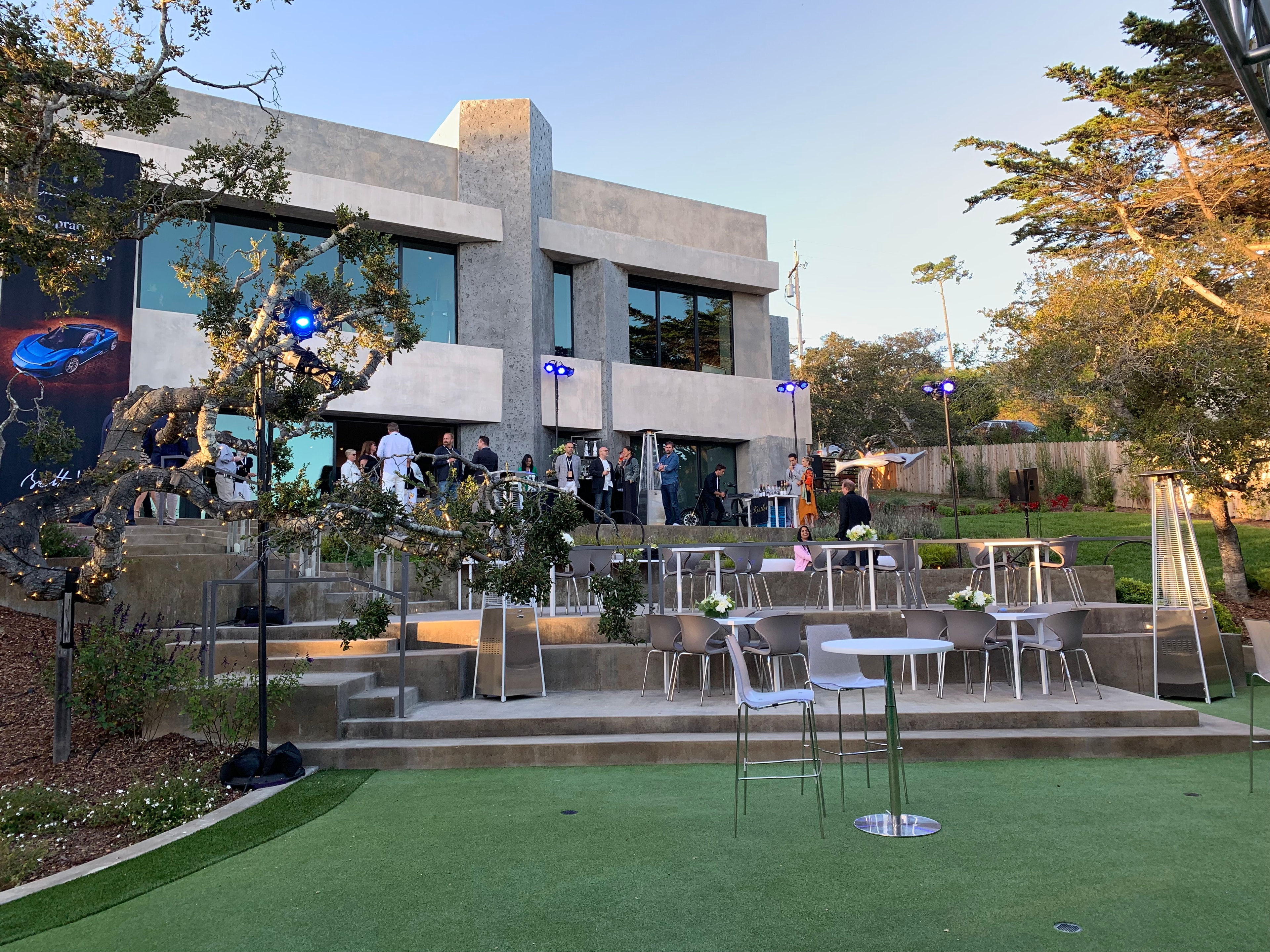 Outdoor evening event at modern architectural venue
